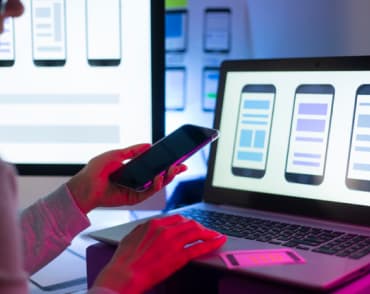 girl chooses smartphone layout on computer